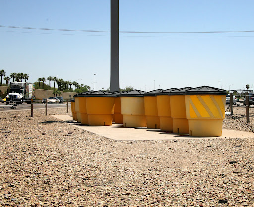 Large barrel shaped containers filled with sand used to cushion crashes.