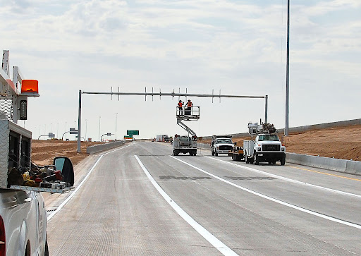Crews work on some finishing touches to the I-10 ramps to Goodyear