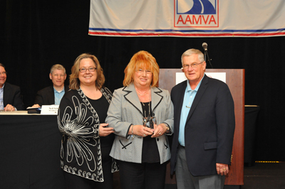 MVD Director Stacey Stanton, left, with Anne Yanofsky and outgoing AAMVA Chair, Mike Robertson.