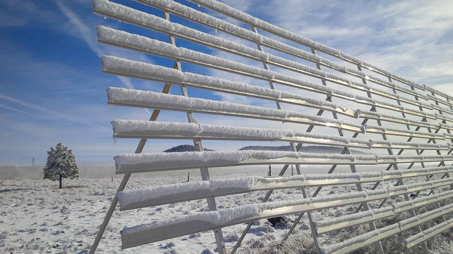 Snow fences are designed to prevent snow from drifting across the highway.