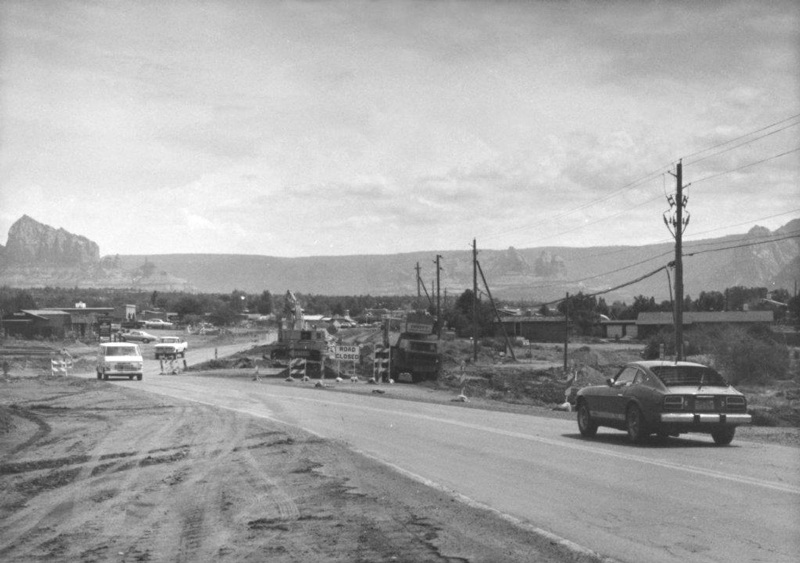 Old black and white photo of SR 179 with the red buttes in the distance