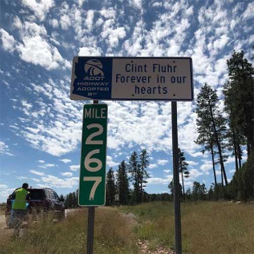 Adopt a highway sign, "Clint Fluhr, Forever in our hearst"