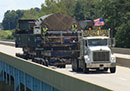 Statewide Restriction Information: commericial truck crossing a bridge