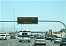 Cars on freeway with dynamic message board