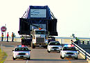 Escort Information and Guidelines: wide-load vehicle being escorted on highway