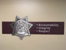 Professional Standards - Wall banner with badge and Accountability, Integrity and Respect listed by it