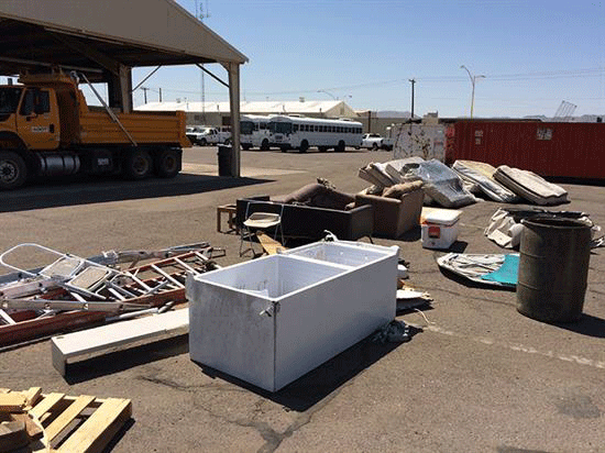 Debris removed from freeway: refrigerator, ladders, mattressses and furniture.