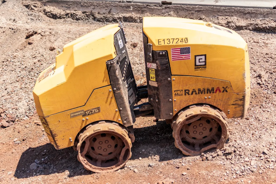 Small, yellow remote-controlled machine helps build ADOT highways