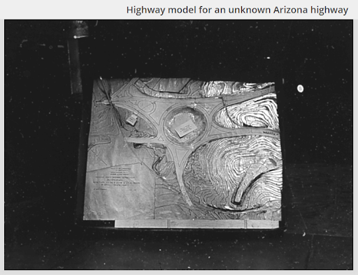 A black-and-white photograph of a highway model of a traffic circle.