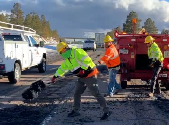 An ADOT crew repairs I-17 pavement damaged by winter weather.
