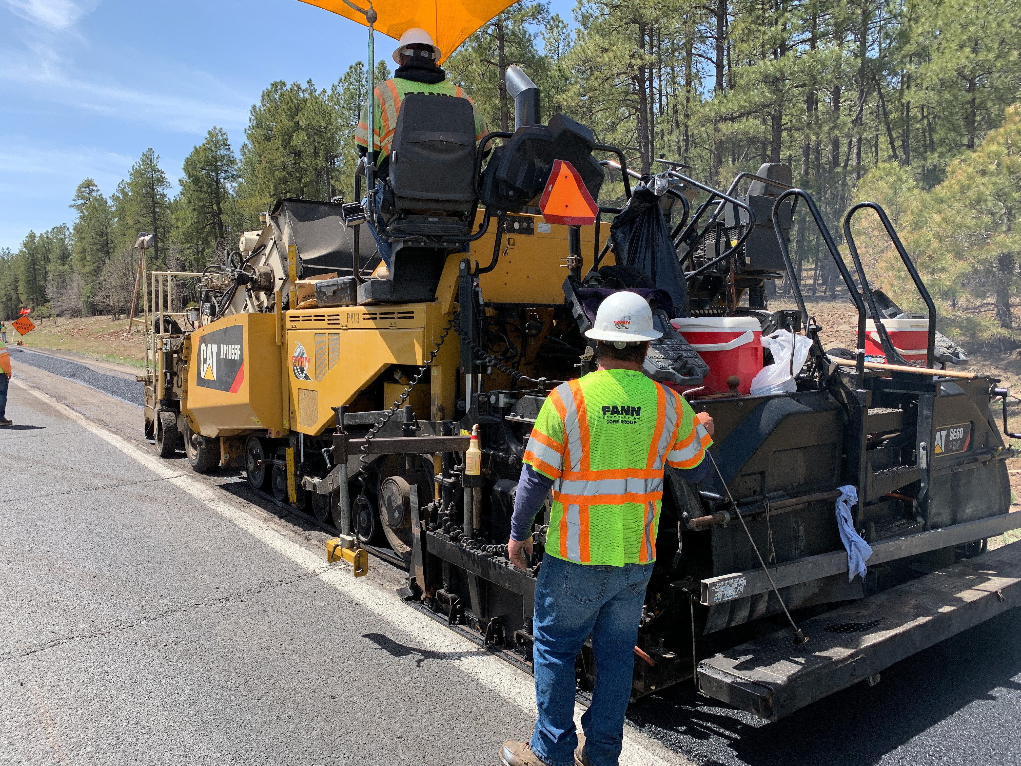 Heavy equipment repairs and replaces pavement on a stretch of highway.