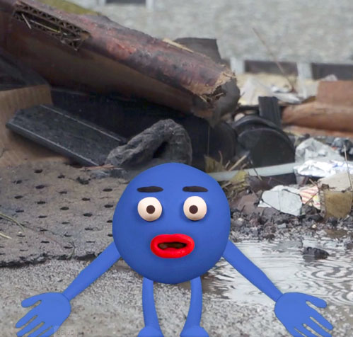 An anthropomorphic rain drop standing in front of a puddle of water, surrounded by various debris.