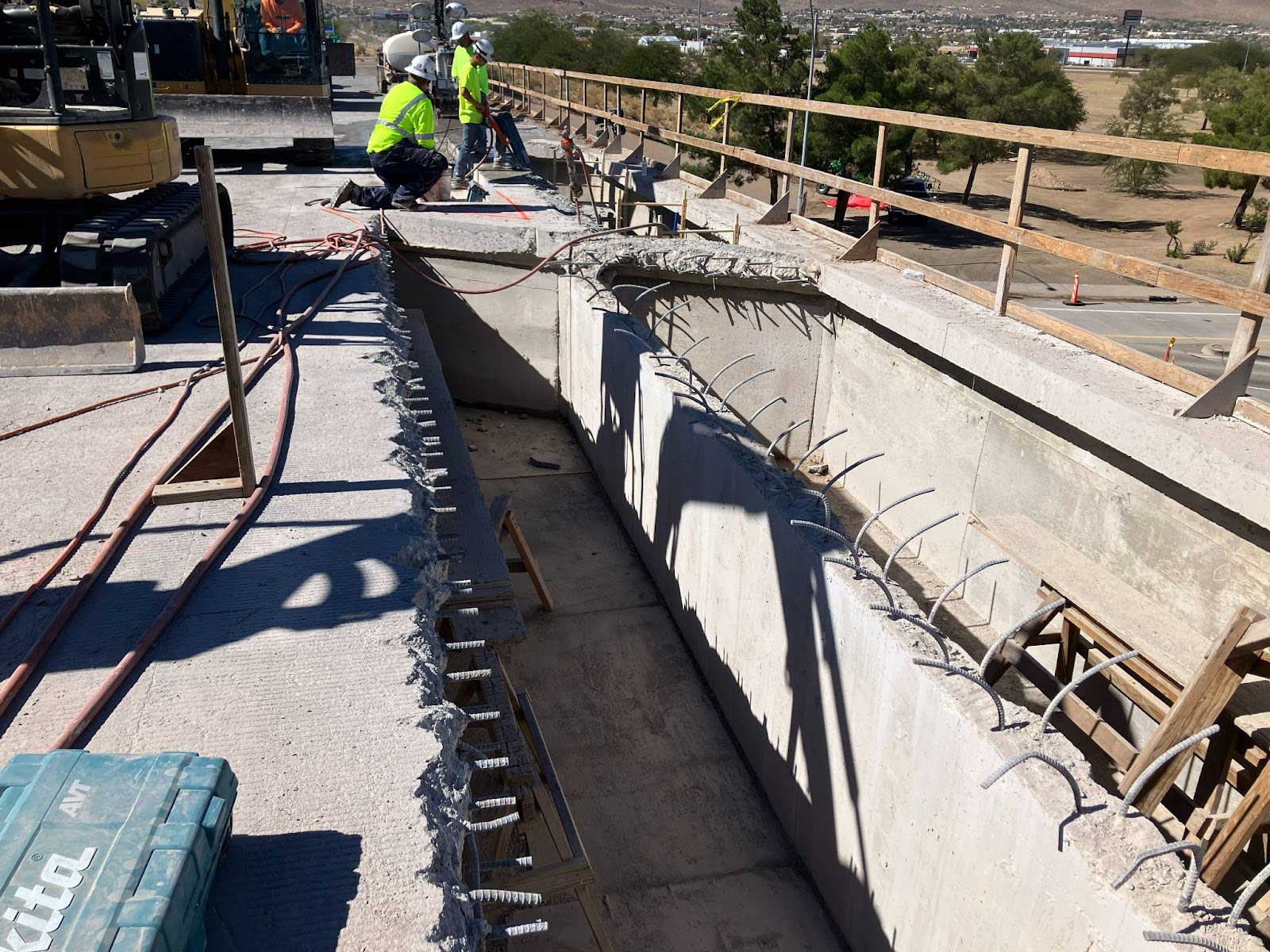 men working on bridge deck