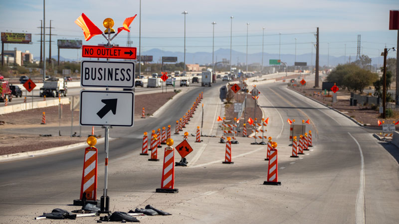 ADOT highway construction with road signage and cones 