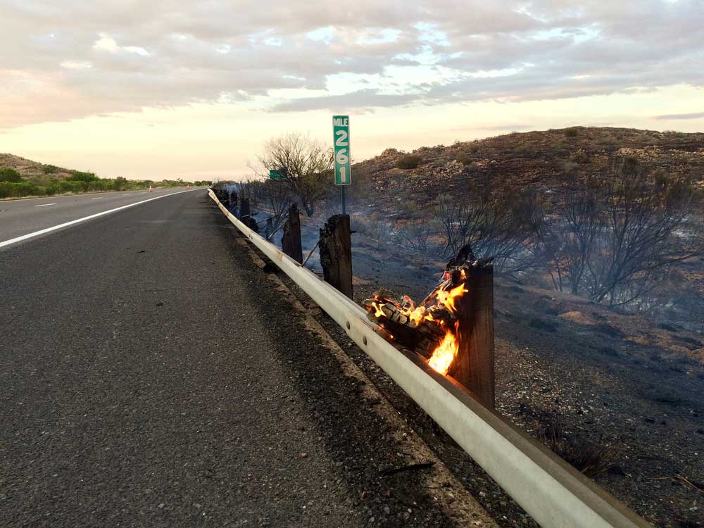 highway guard rail on fire