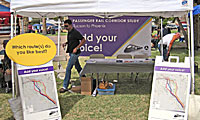 Passenger rail booth at community event