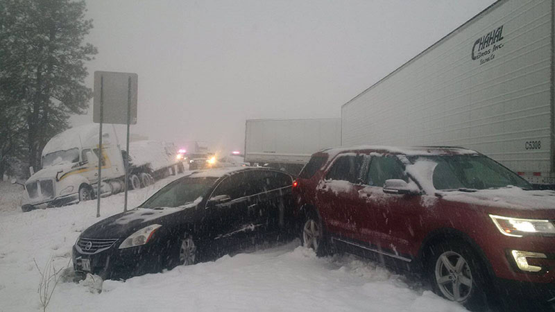 Multiple vehicle roadway crash in snow