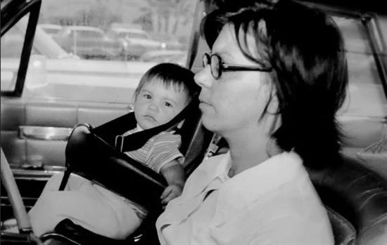 b/w photo of a child seat in the front of a car