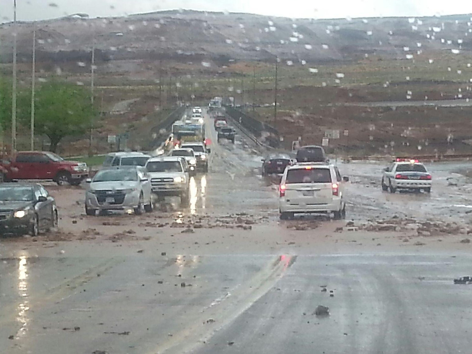 mud and rocks blocked the roadway near Glen Canyon Dam