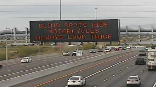 "Blind spots hide motorcycles - always look twice"