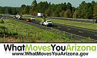 Extensive campaign sign - What Moves You Arizona is overlooking a highway traffic scenery