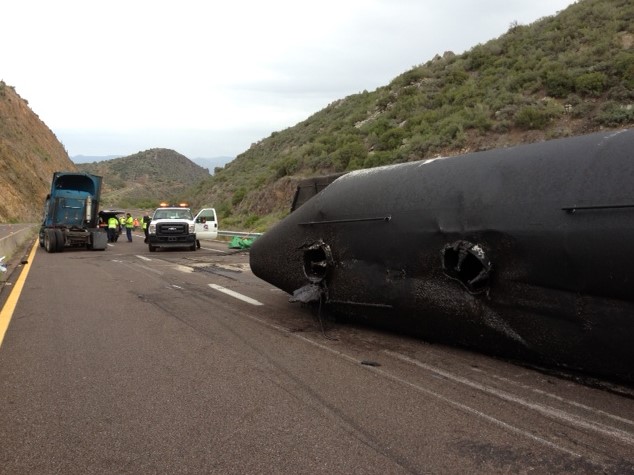 Overturned tanker and spilled contents on State Route 87