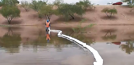 ADOT Hazmat Crew member cleans the site after a major crash