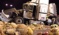 A crashed semi-truck surrounded by scattered produce in the Deck Park Tunnel on Interstate 10 in Phoenix Arizona.