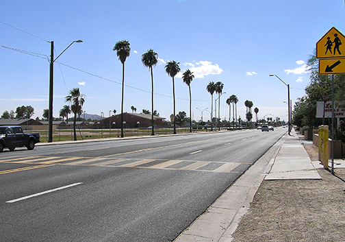 Palm trees line State Route 387 in Casa Grande.