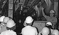 Old photo of tunnel and people wearing hard hats