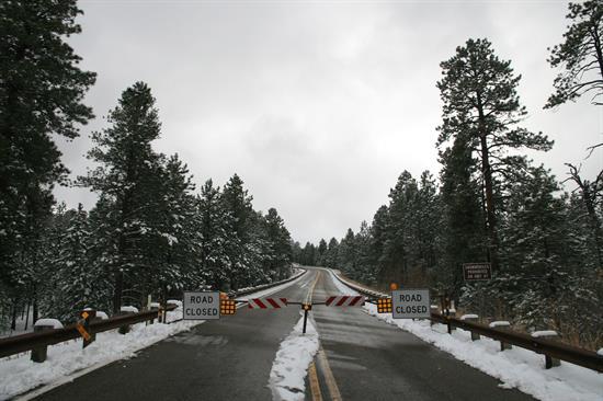 Road closed signs and barrier on State Route 67