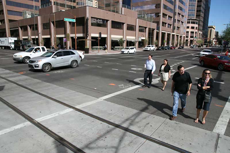 People using crosswalk in city