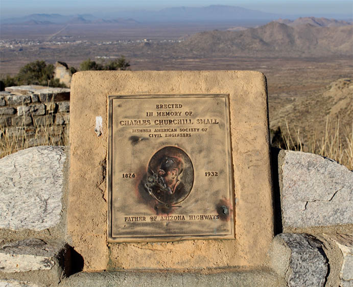 A plaque honors Charles Churchill Small Father of Arizona Highways with mountains and desert in the background.