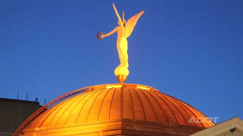 State Capitol dome in orange light
