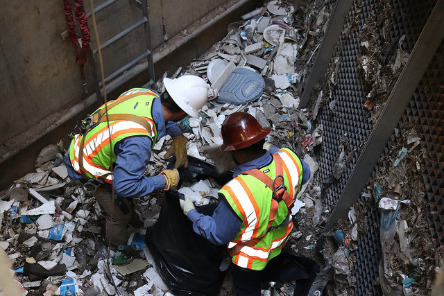 Workers remove litter accumulated deep in ADOT pump station