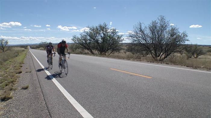 Bike riders on highway