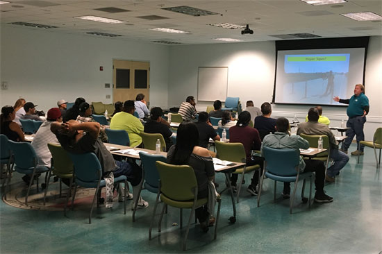 Construction Academy classroom with attendees