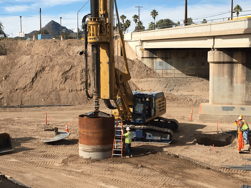 Large machine drills hole for bridge pier