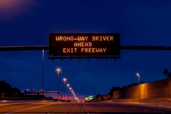 Wrong-way driver warning on freeway message board