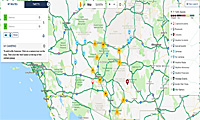 Screenshot of a digital traffic map showing roads, highways, and color-coded traffic conditions in Southern California, with icons for alerts and incidents.