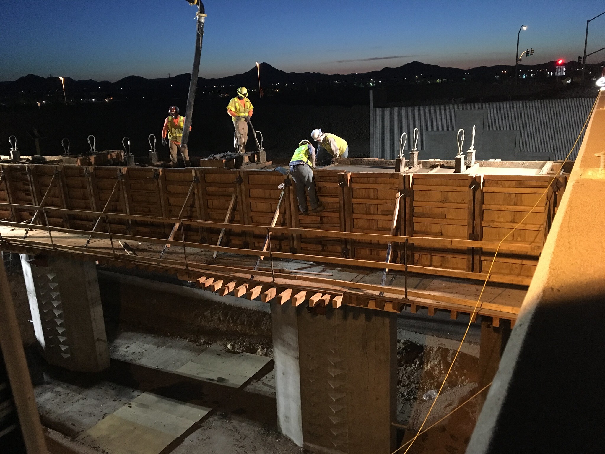 Crew members work on deck of Pinnacle Peak bridge