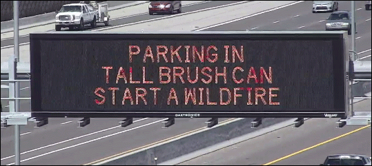 Freeway message board carrying message about wildfire prevention
