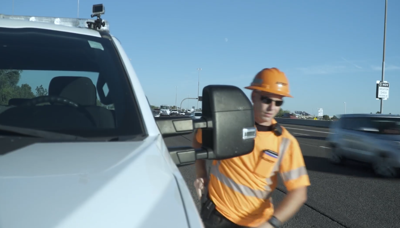Incident Response Unit member exits his truck along freeway.