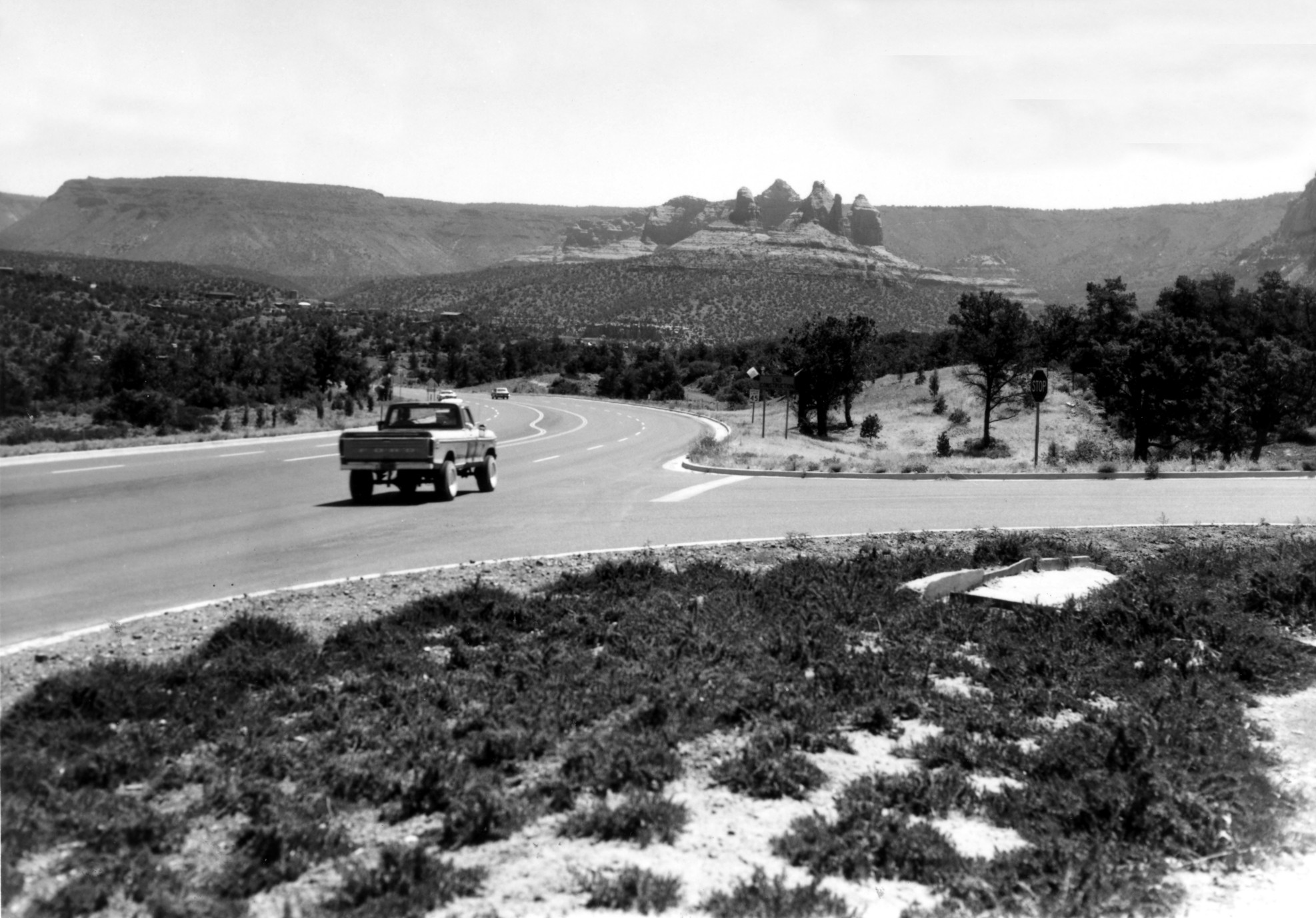 Black and white image of truck driving on SR 89A