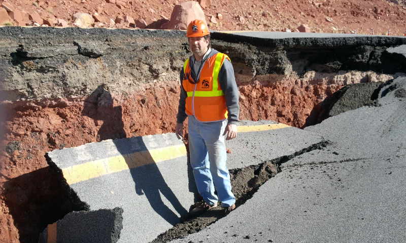 Patrice Brun at site of road damaged by earth movement