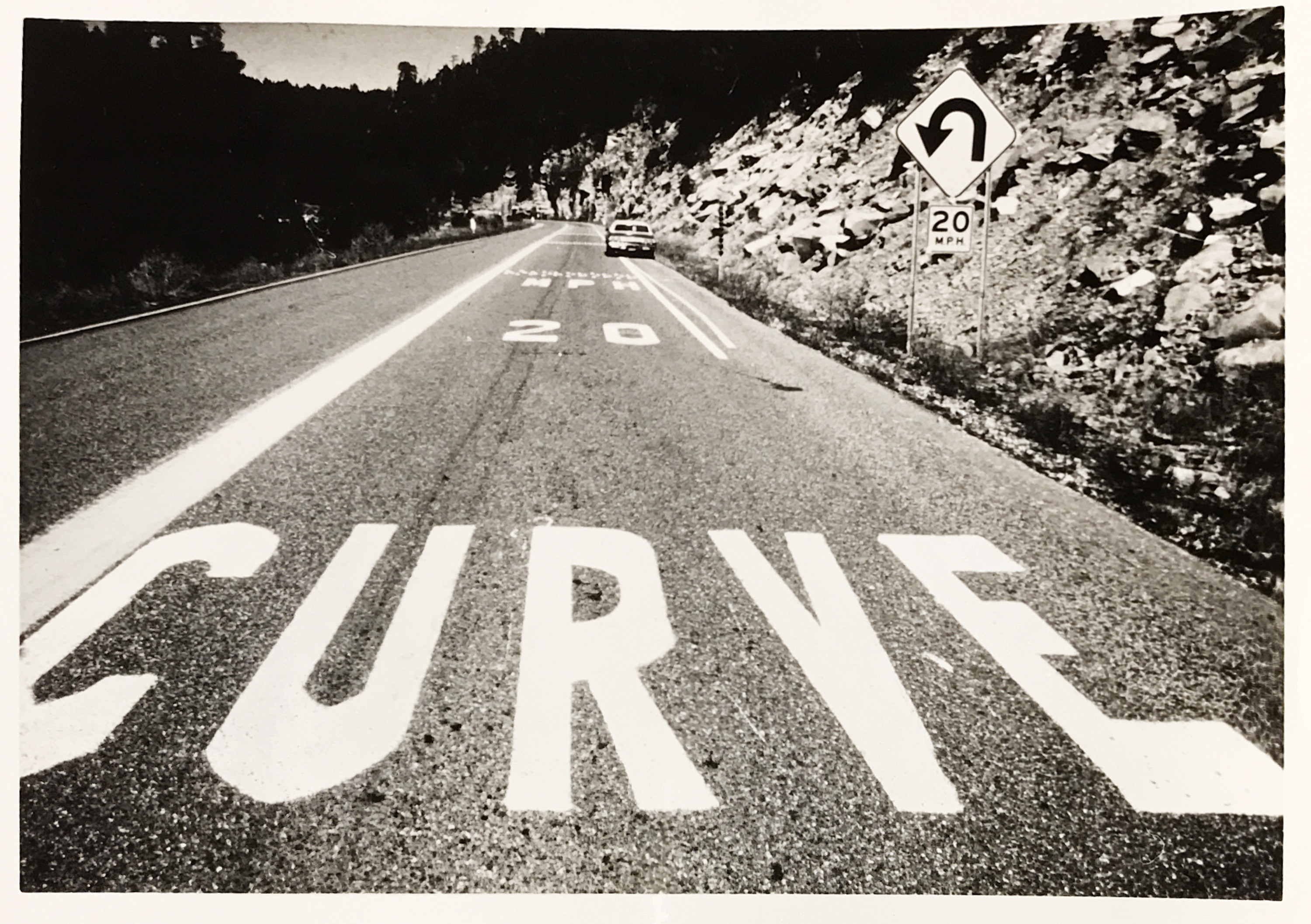 Image of SR 87 with curve warning painted on road