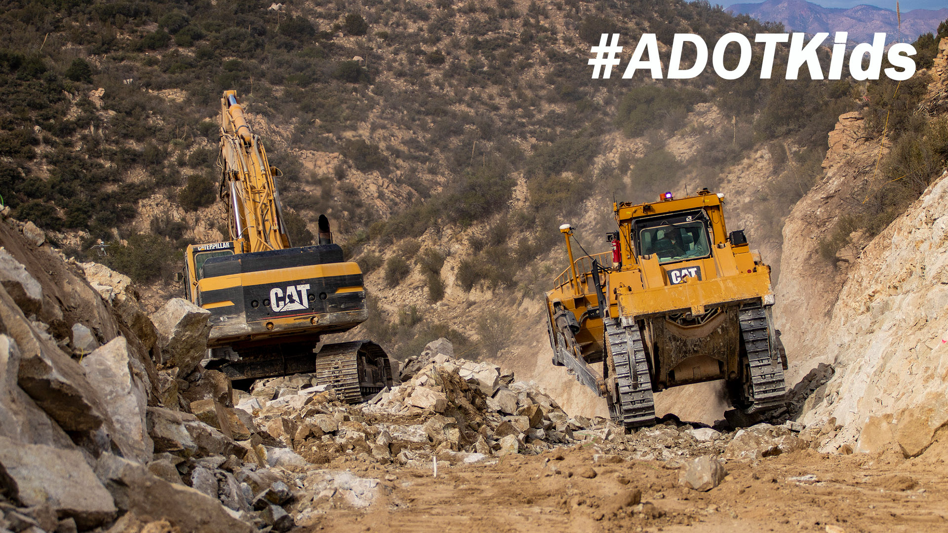 ADOT Heavy Equipment at construction on rocky site