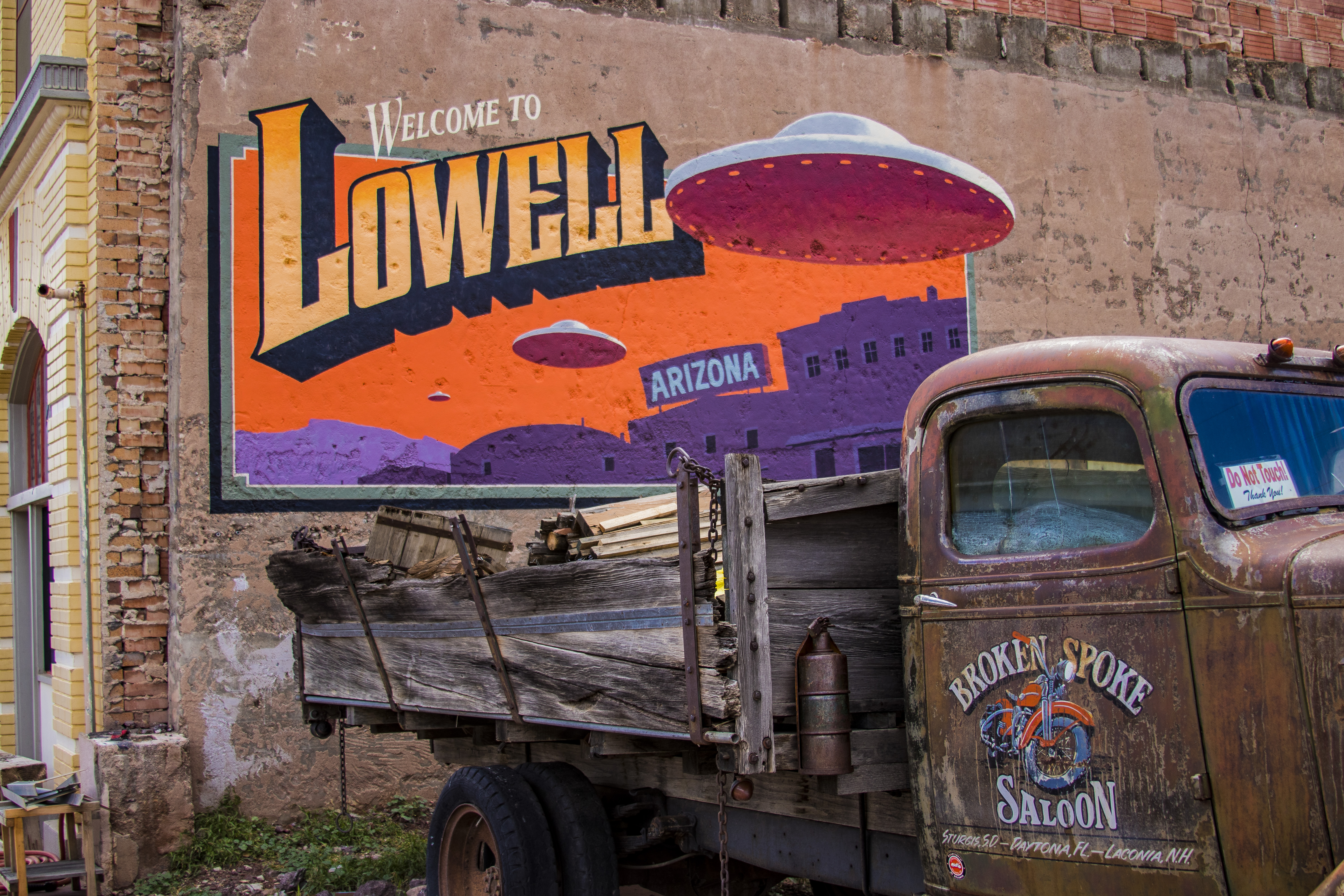 Mural on side of brick building welcomes people to Lowell.