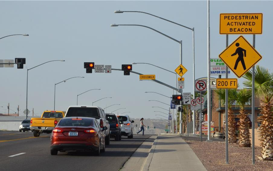 Photo of pedestrian hybrid beacon and cars