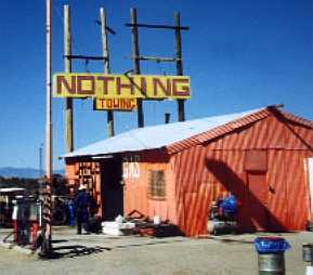 Sign for Nothing, Arizona, and red building